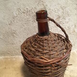 Tank in old glass and wicker