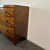 English commode from the George III Regency period, bombe shape in mahogany veneer.
