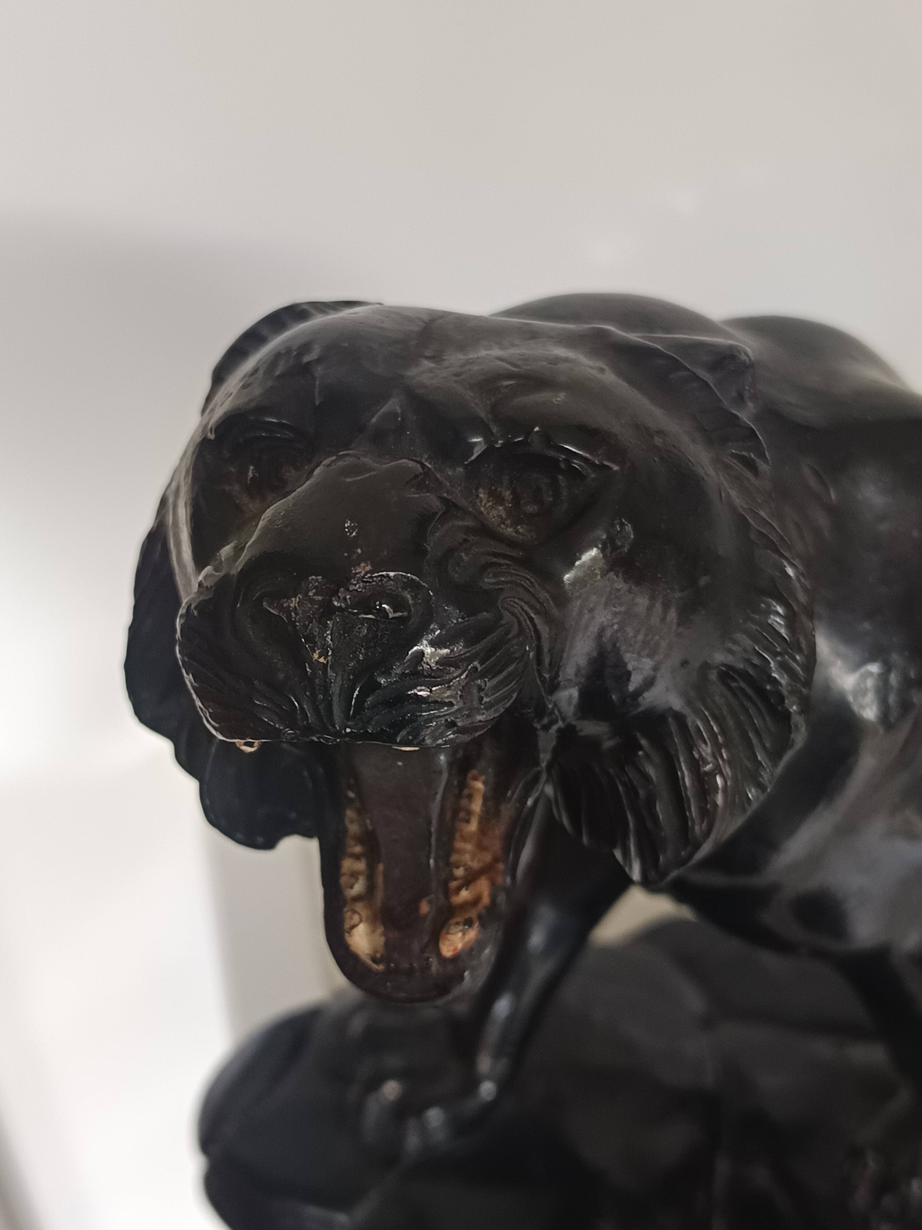 Large animal sculpture representing a roaring panther, signed BE.