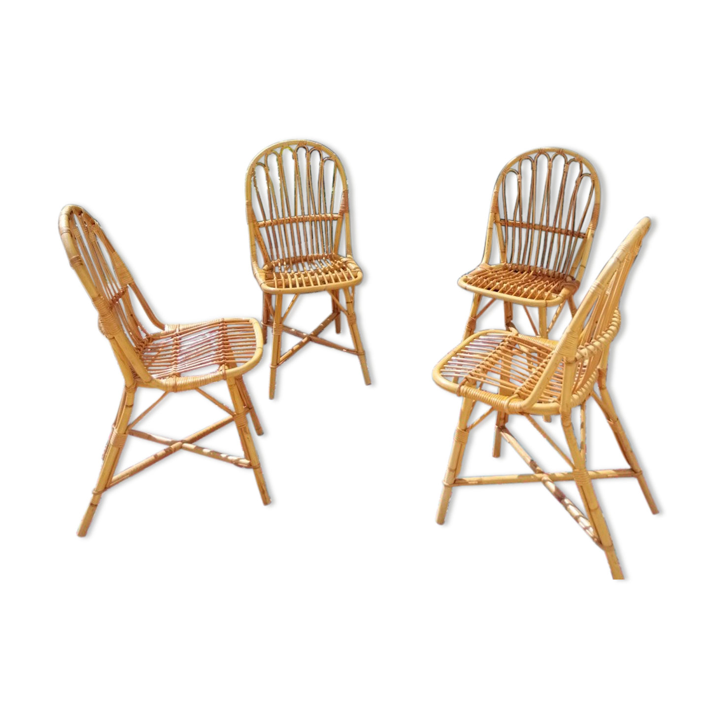 Series of 4 vintage rattan chairs.