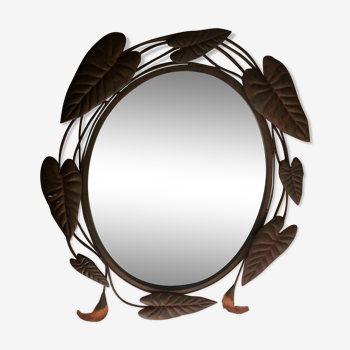 Miroir ovale entourage fer forgé en forme de fleurs et feuillage noir 69x55cm