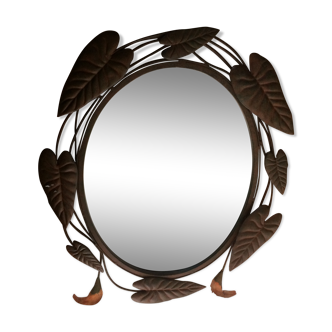 Oval mirror around wrought iron in the shape of flowers and foliage. black 69x55cm