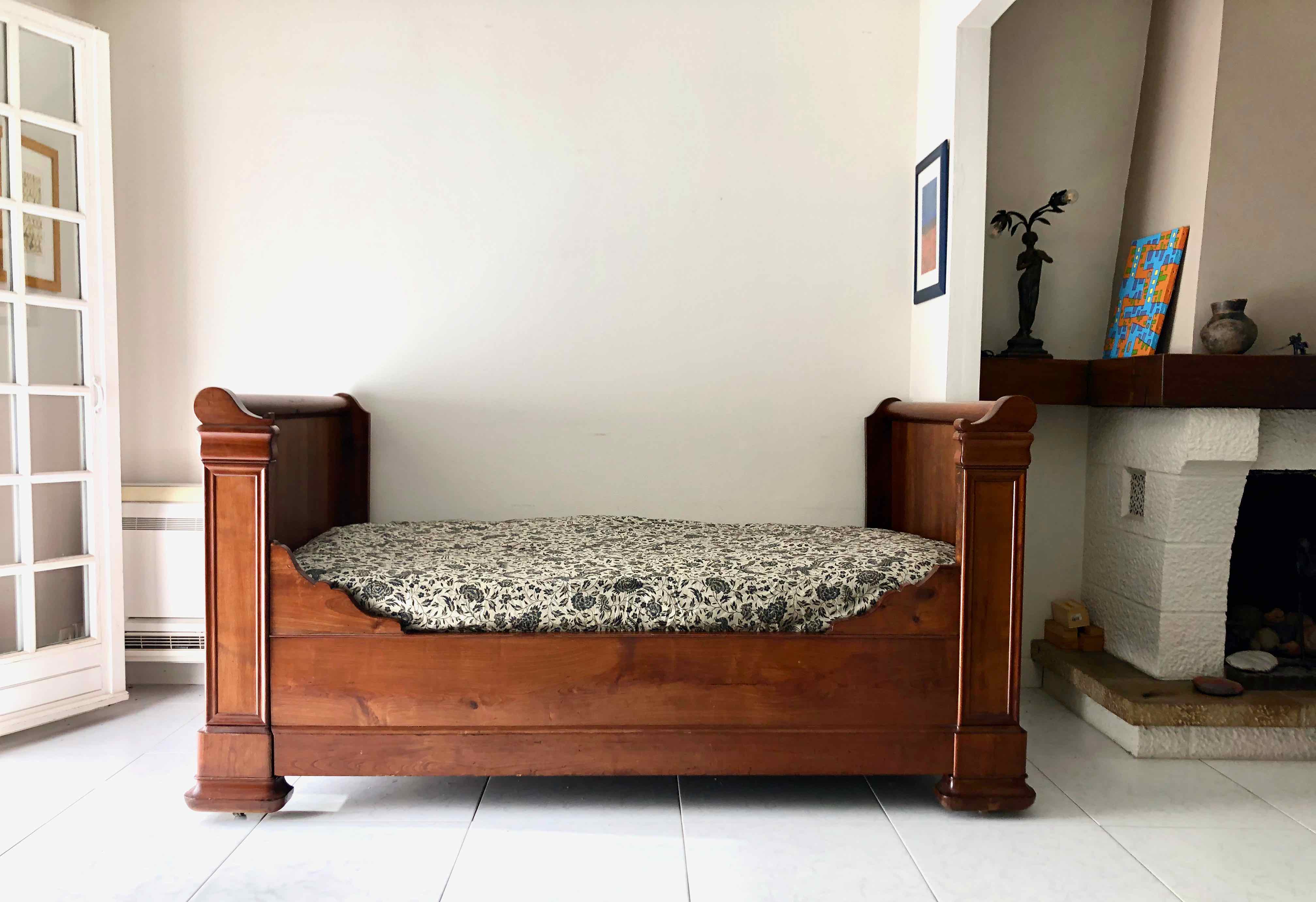 Cherry wood boat bed with bedding