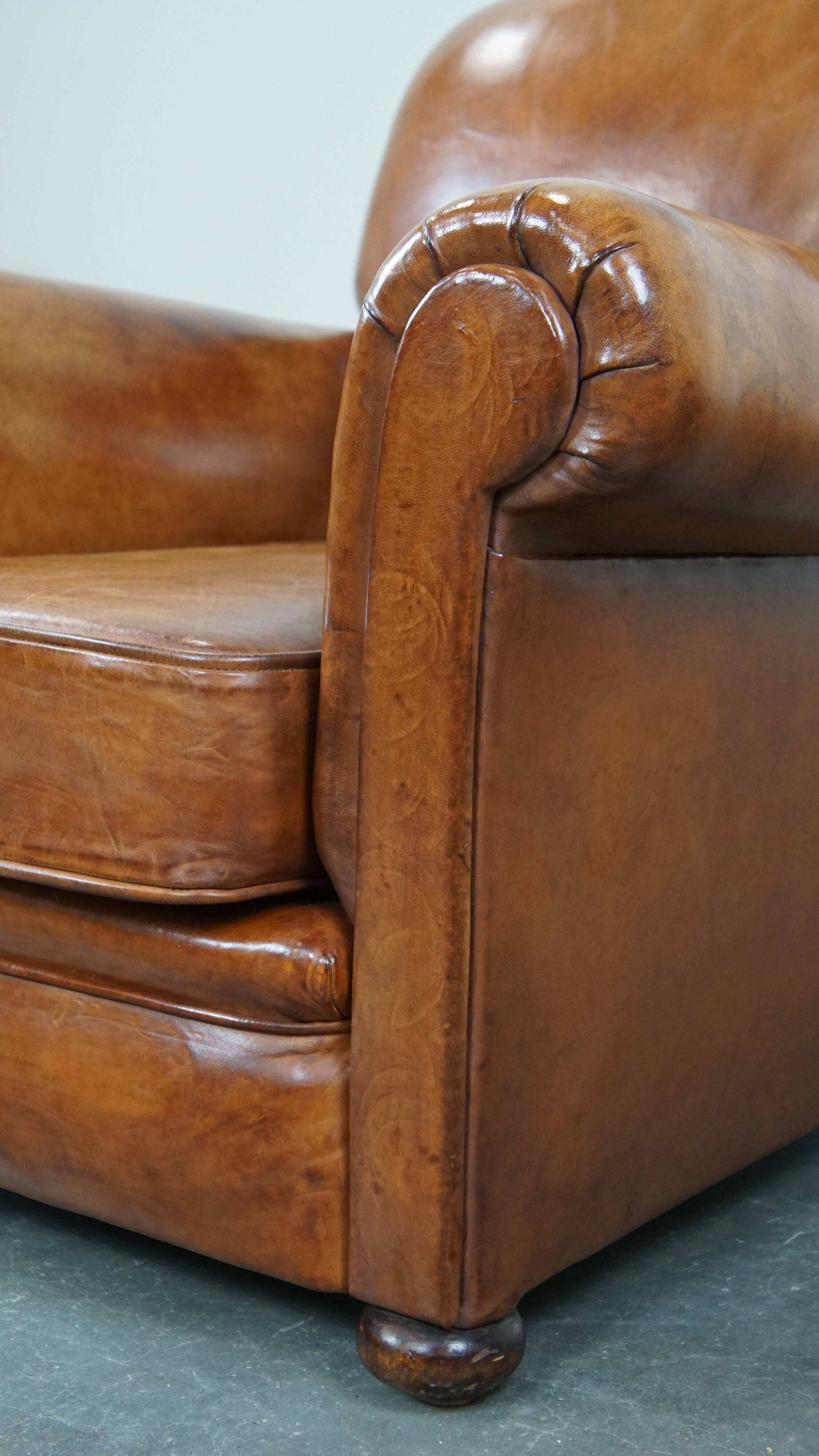 Cognac-colored antique sheep leather armchair