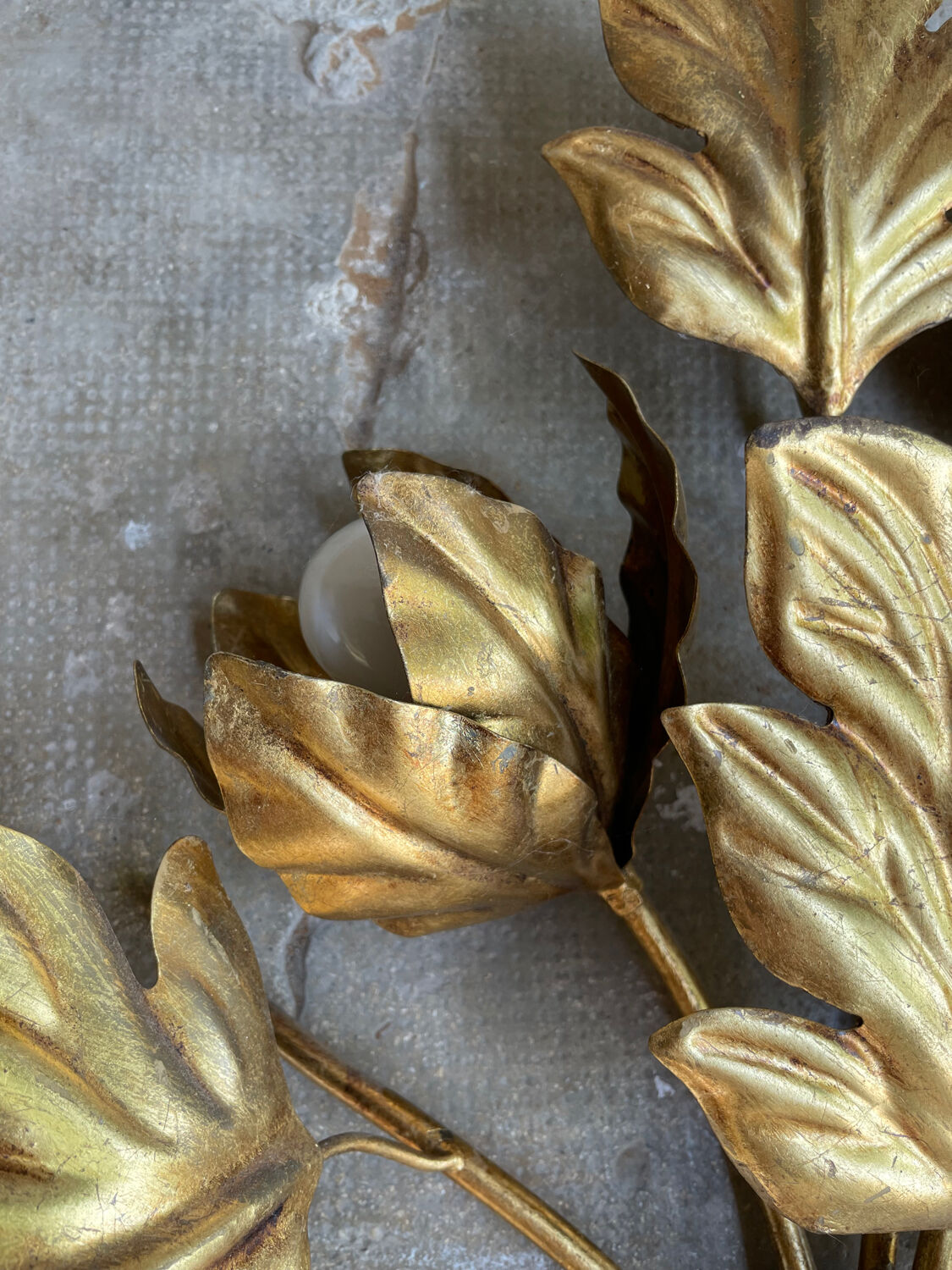 Golden wall lamp foliage
