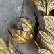 Golden wall lamp foliage