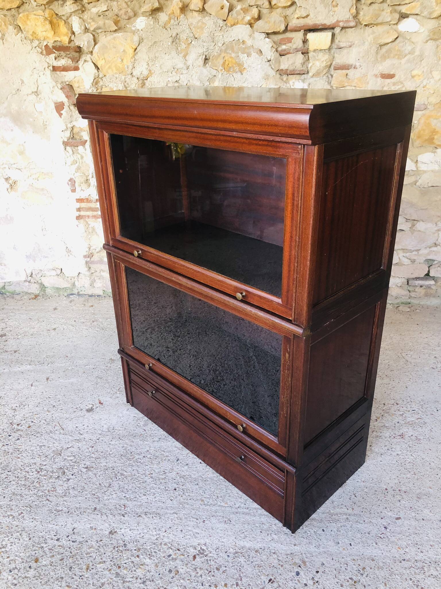 Vintage mahogany avocado bookcase with overhead glass doors circa 40's/50's