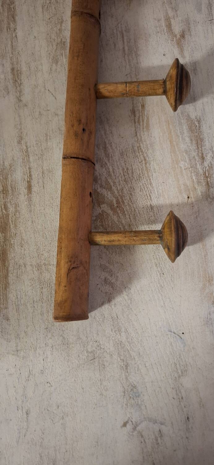 Turned wooden coat rack.