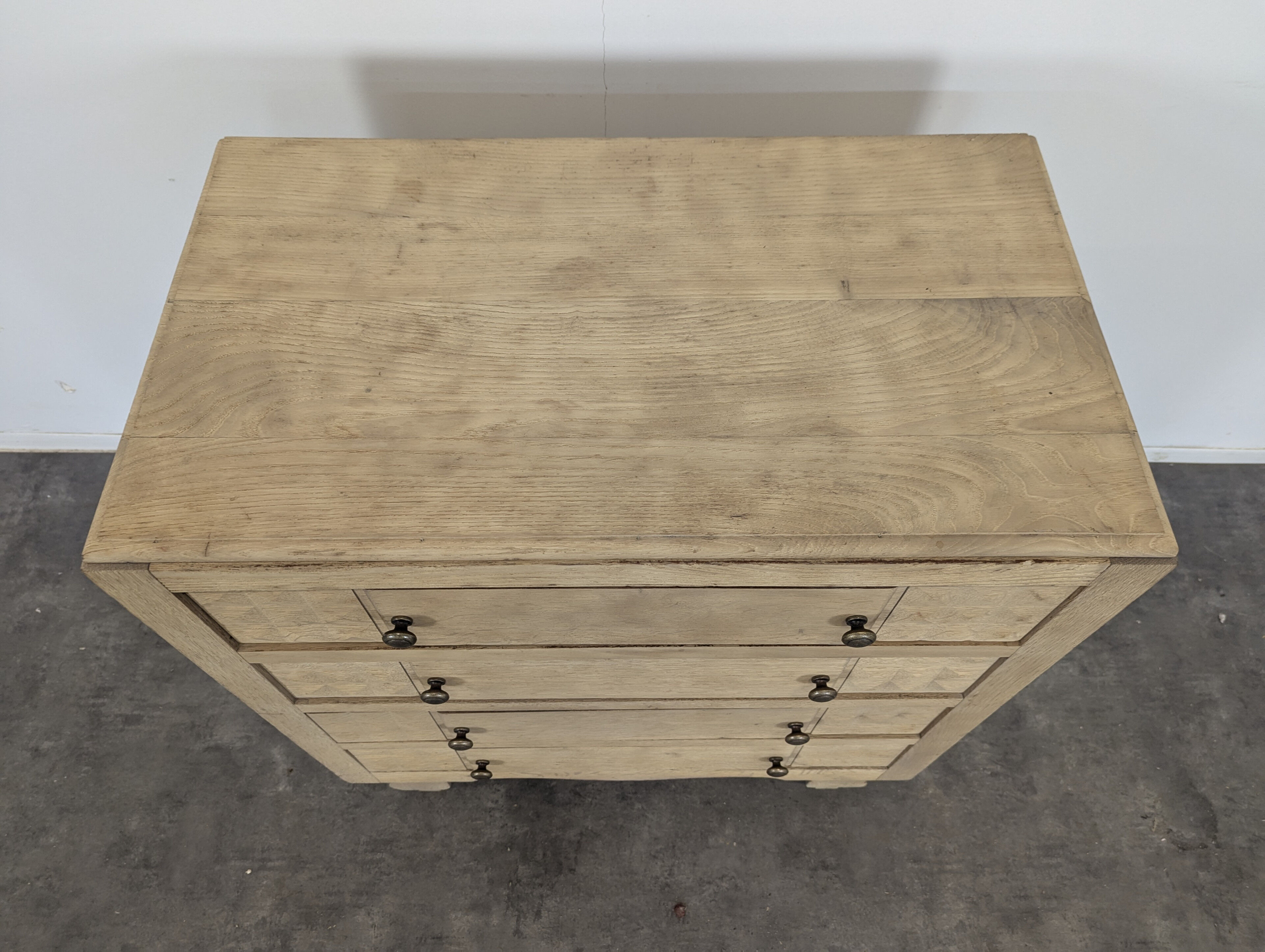 Brutalist commode with stripped diamond tips.