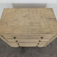 Brutalist commode with stripped diamond tips.