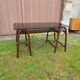 Smoked glass desk on rattan legs and leather detail