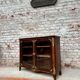 Low showcase in rosewood veneer of the regency xviii th century