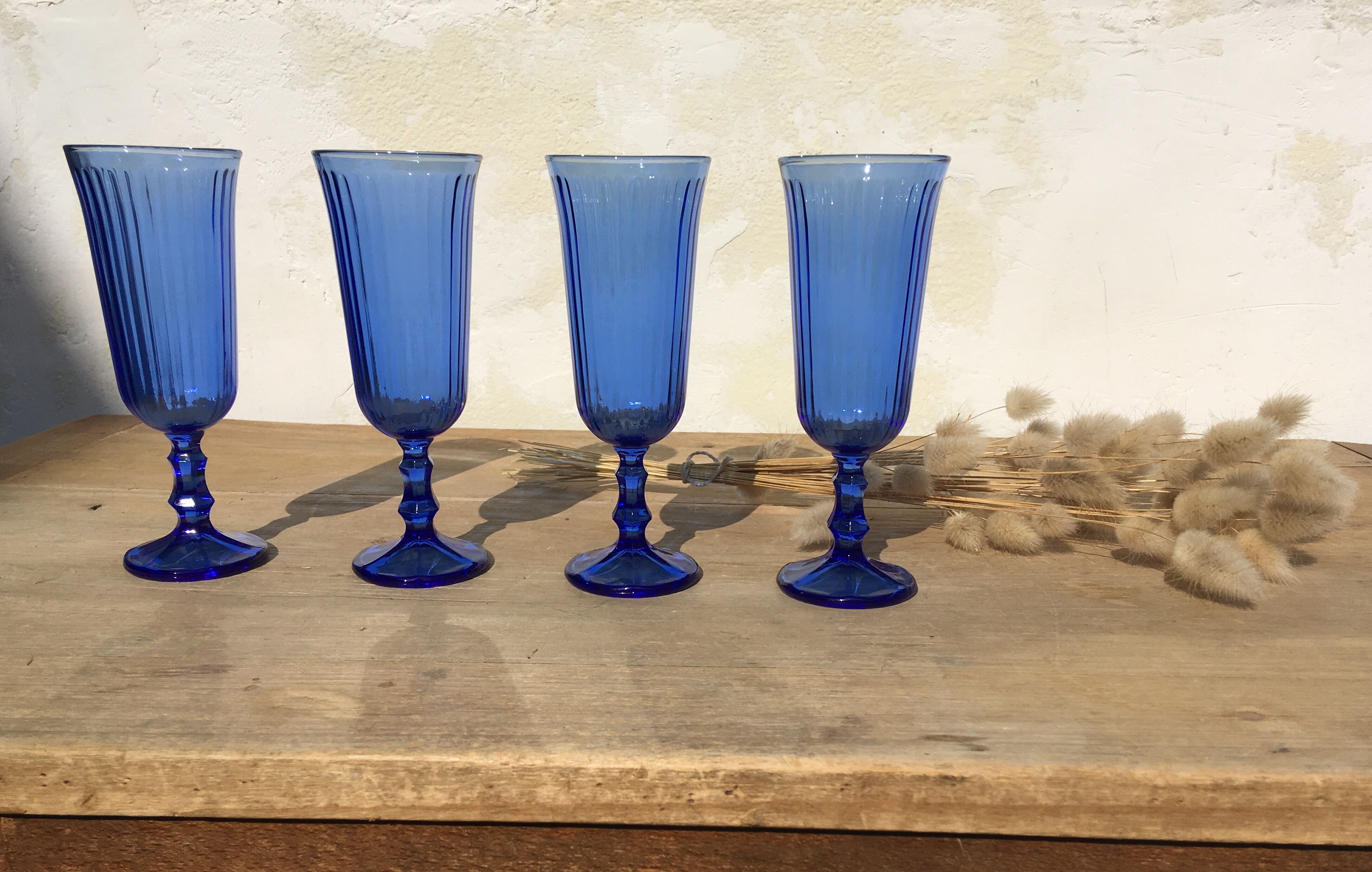 Champagne flutes in blue glass