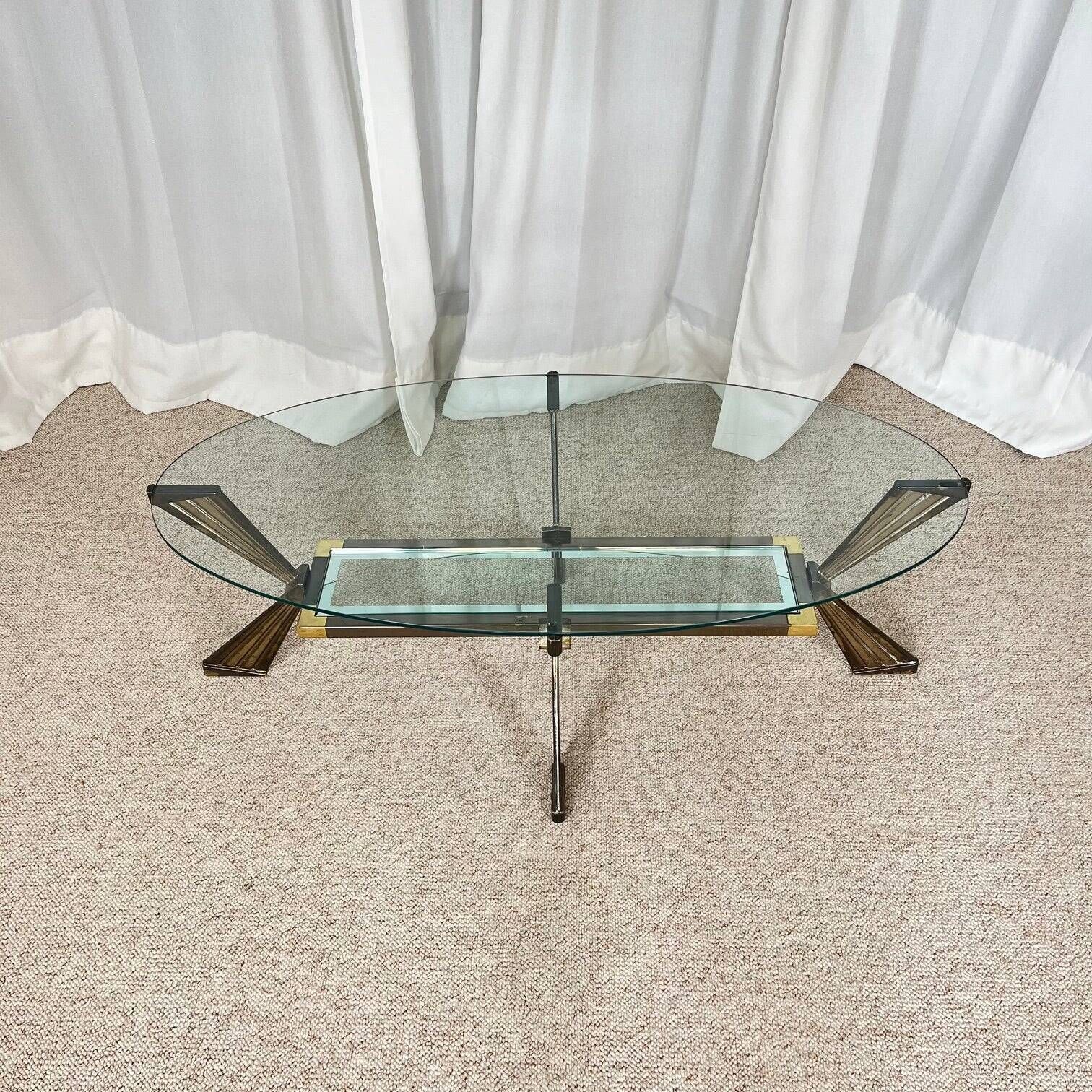 Vintage Italian coffee table in glass, chrome and brass metal, Hollywood Regency style, 1970s.