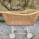 Wicker cradle on wheels, late 19th century