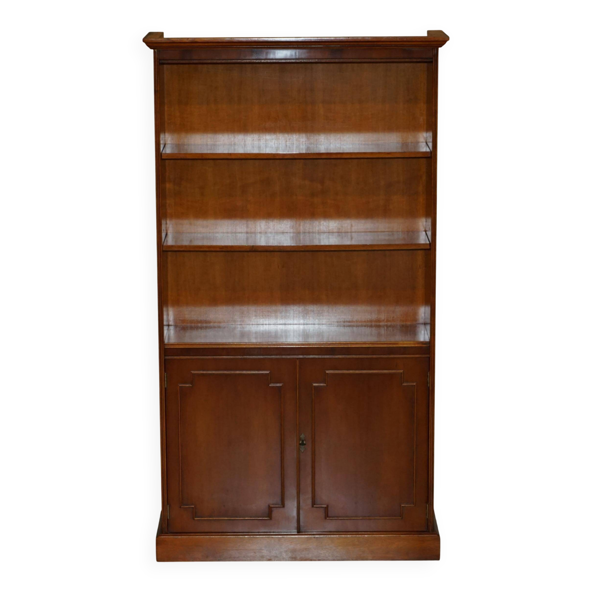 Open library Bradley Furniture made of yew wood with a cupboard base.