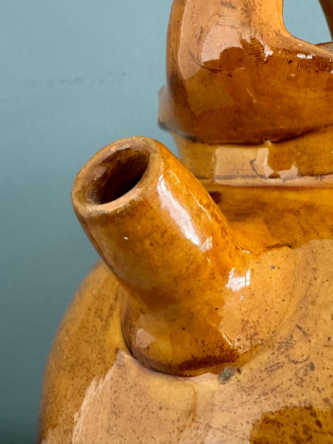 Old terracotta gargoulette jug