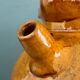 Old terracotta gargoulette jug