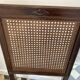 Vintage folding chair with cane seat in dark mahogany wood