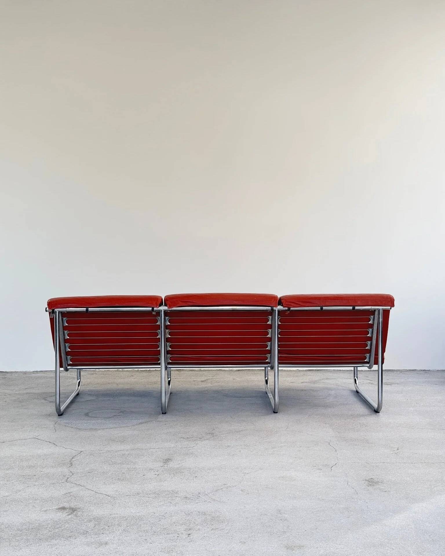 Red leather Remmi sofa by Yrjö Kukkapuro