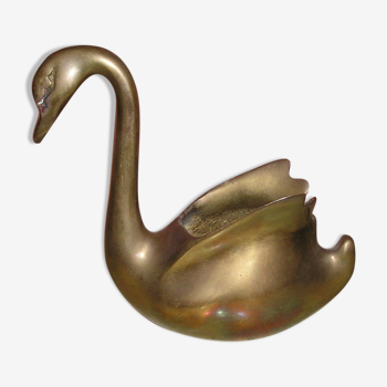 Empty brass swan pocket