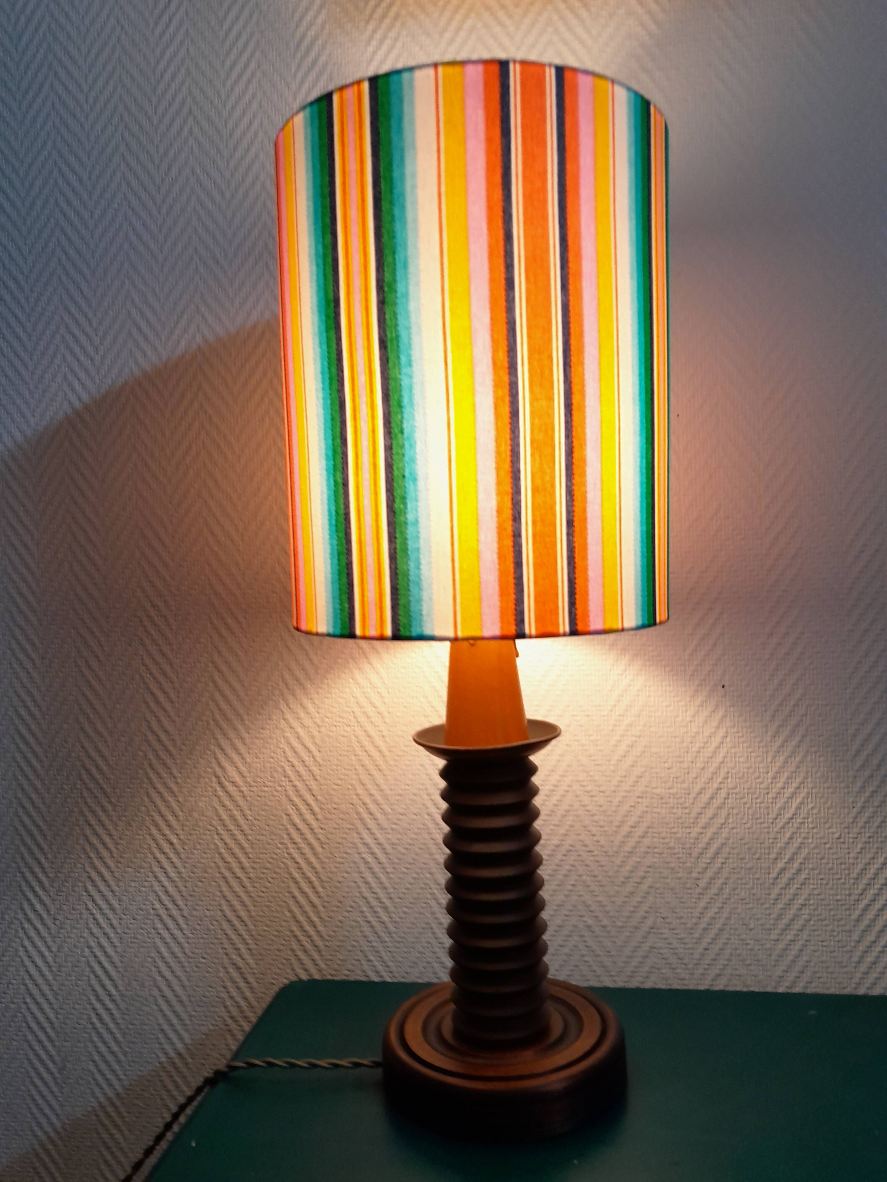 Wooden lamp with striped lampshade