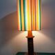 Wooden lamp with striped lampshade