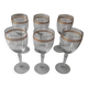 Set of 6 glasses with gold band decorations.