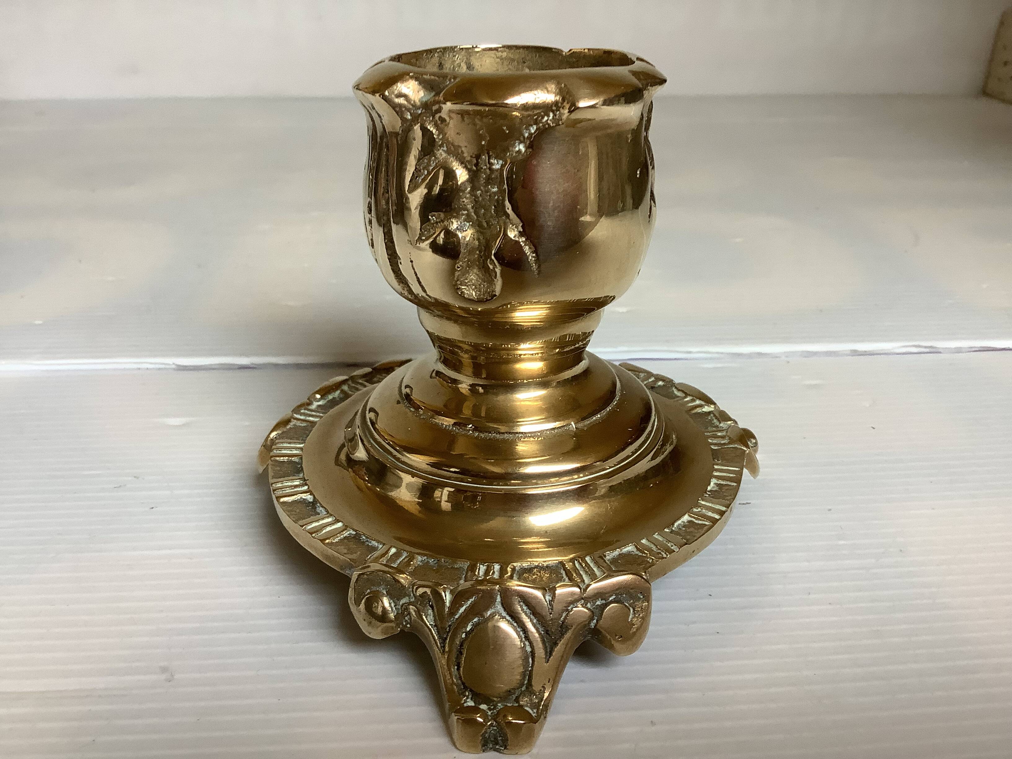 Tripod candlestick in worked bronze