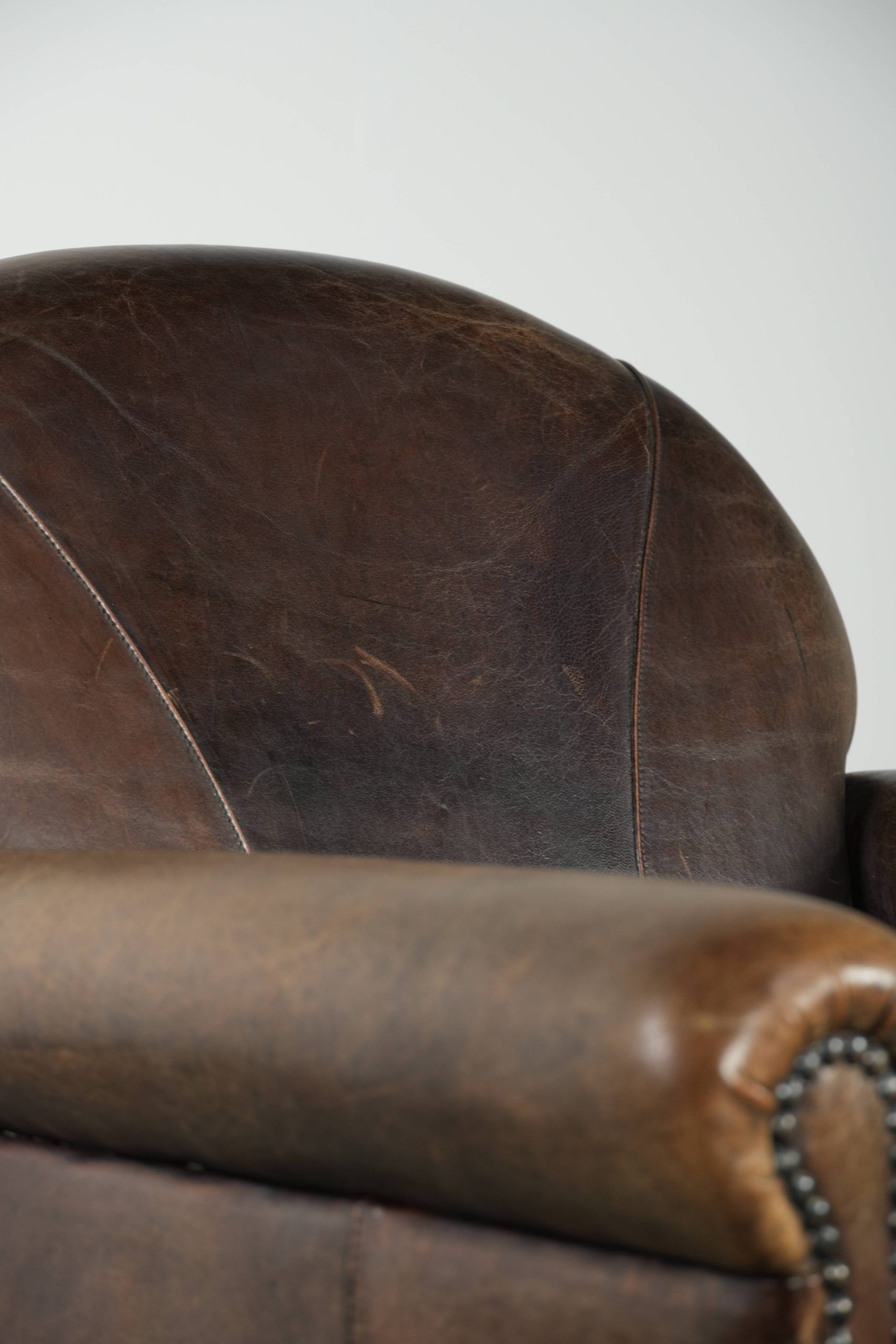 Characterful sheepskin design armchair with beautiful patina