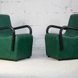 Pair of armrest heaters. Steel and green imitation leather. France, circa 1980