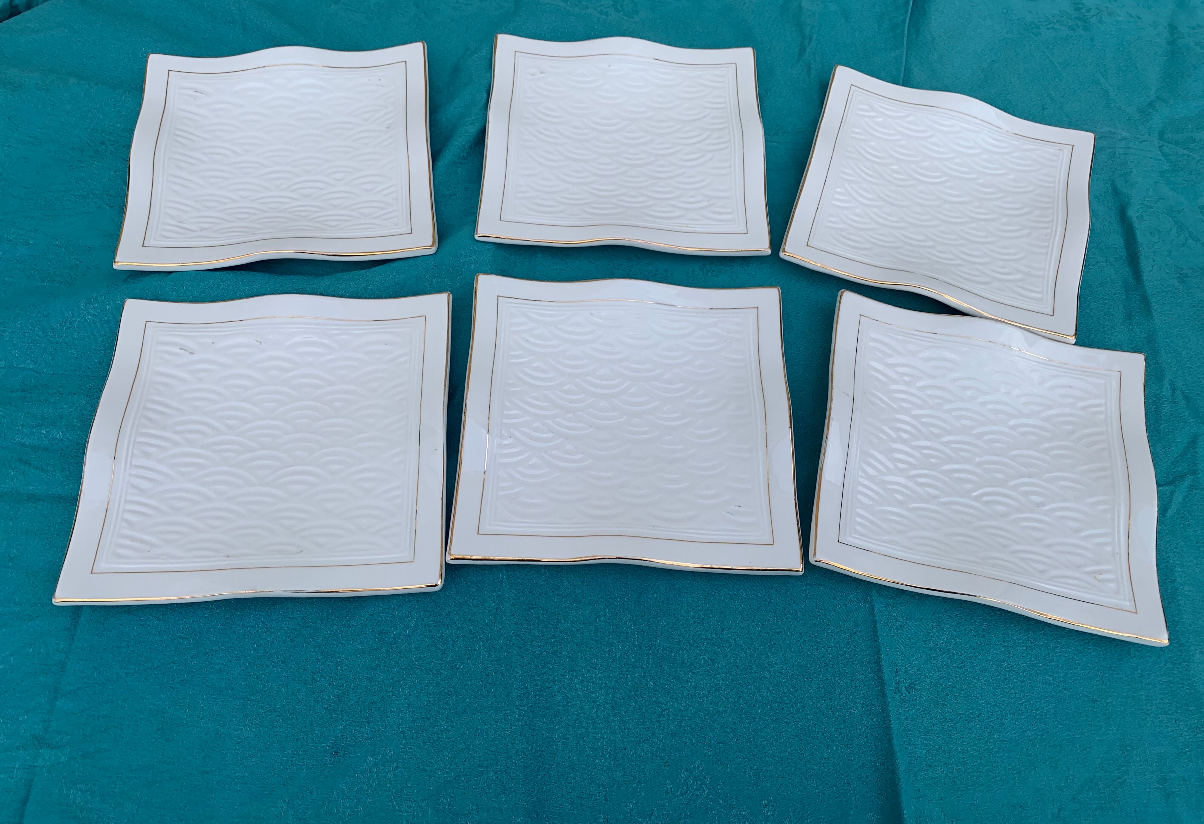 6 white glazed ceramic plates vague design and contemporary patterns