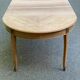 Round extendable dining table stripped in cherry wood with Louis XVI marquetry 1