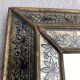 Eglomisé mirror with wooden parecloses