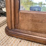 Beveled art deco mirror, carved wood