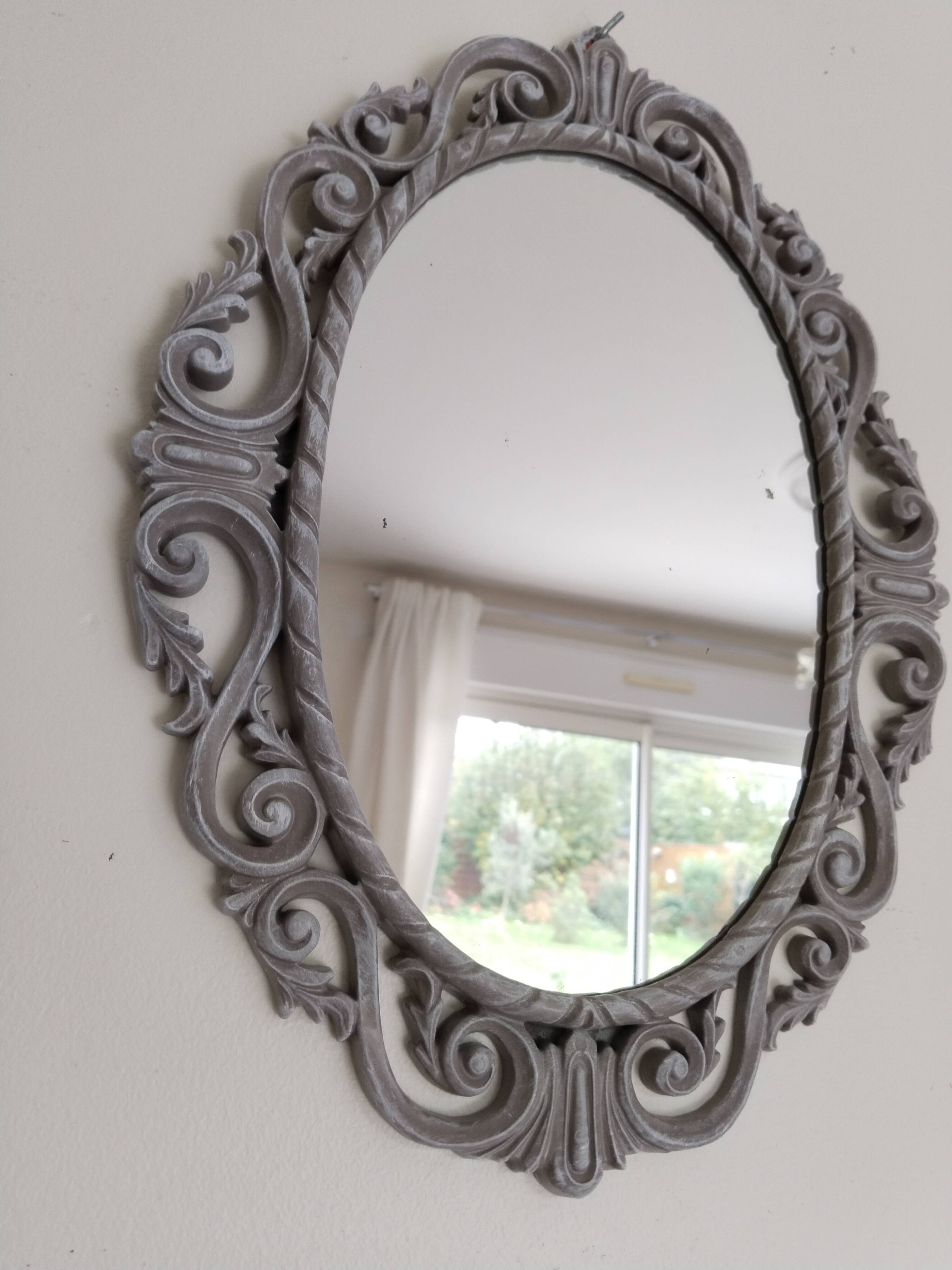 Louis XVI style patinated oval mirror