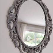 Louis XVI style patinated oval mirror