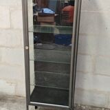 old medical display case with a graphite metal door