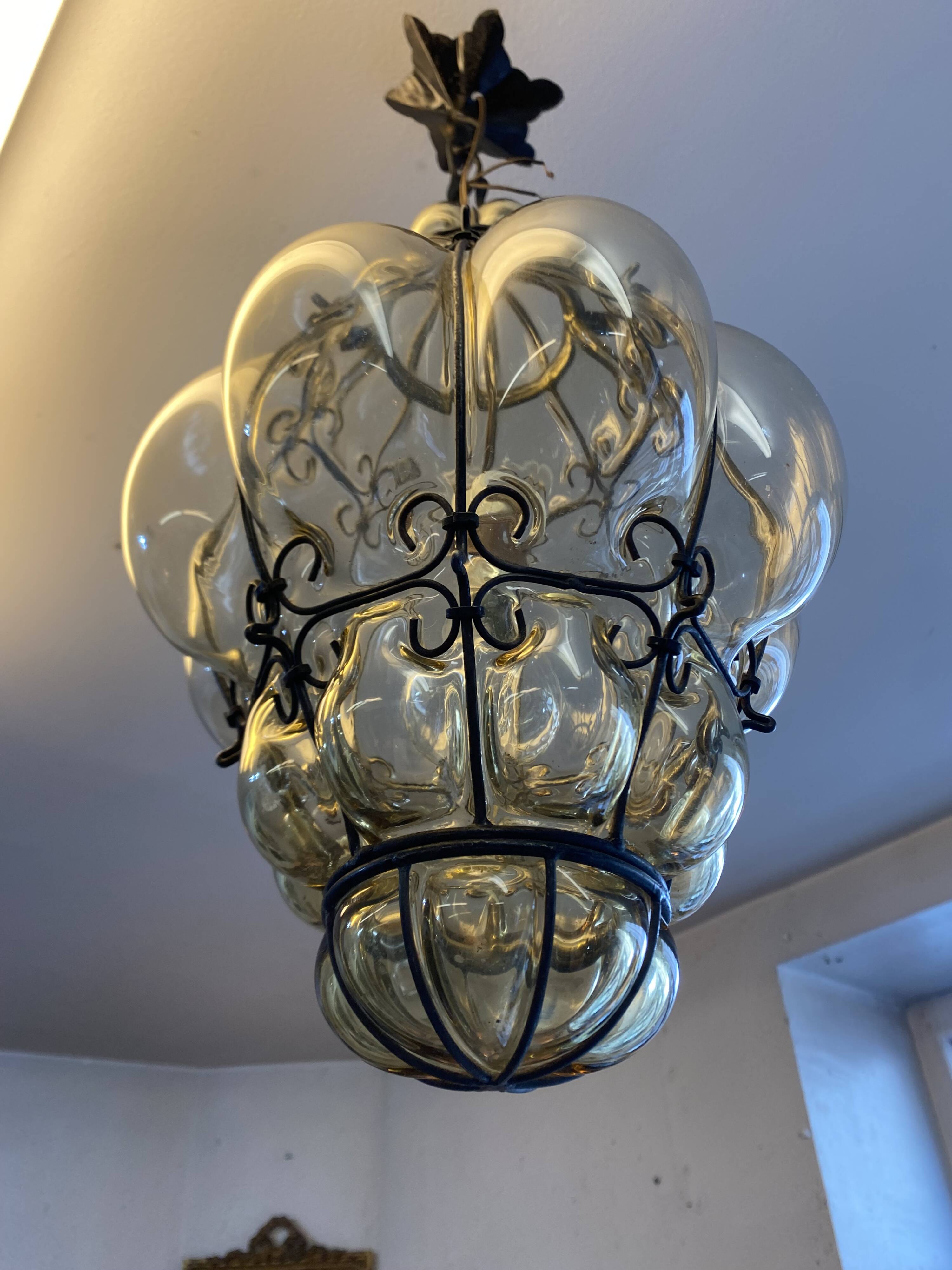 Blown glass and metal lantern