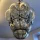 Blown glass and metal lantern