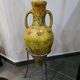 Large decorative vase with handles – painted floral design – on a metal stand