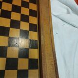 old wooden game board: small horses and checkers