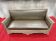 Antique banquette covered in faux shagreen.