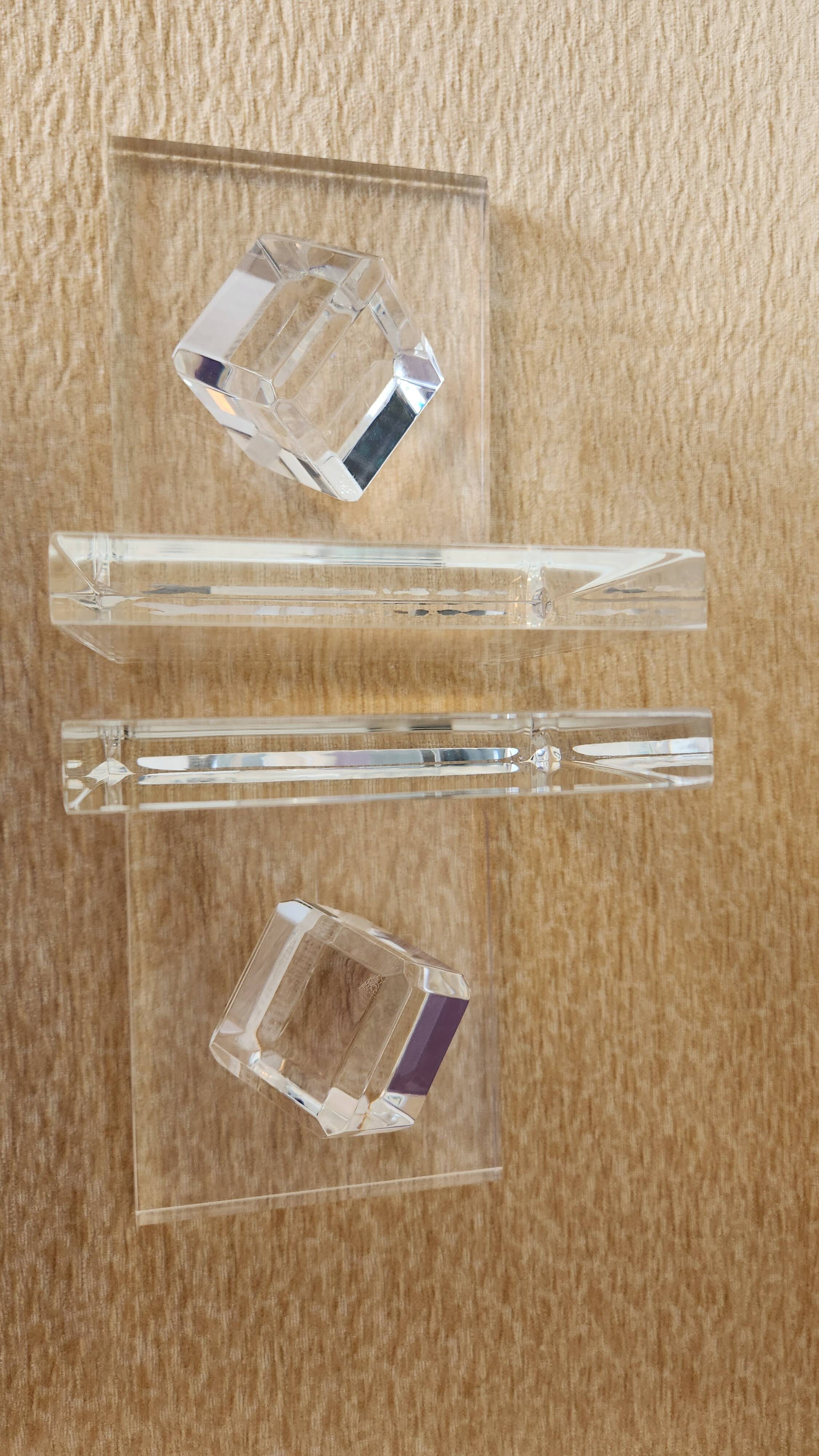 Pair of solid plexiglass bookends, faceted cubes, 1980s