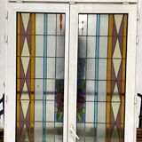 Pair of two-leaf windows in 20th century Art Deco stained glass