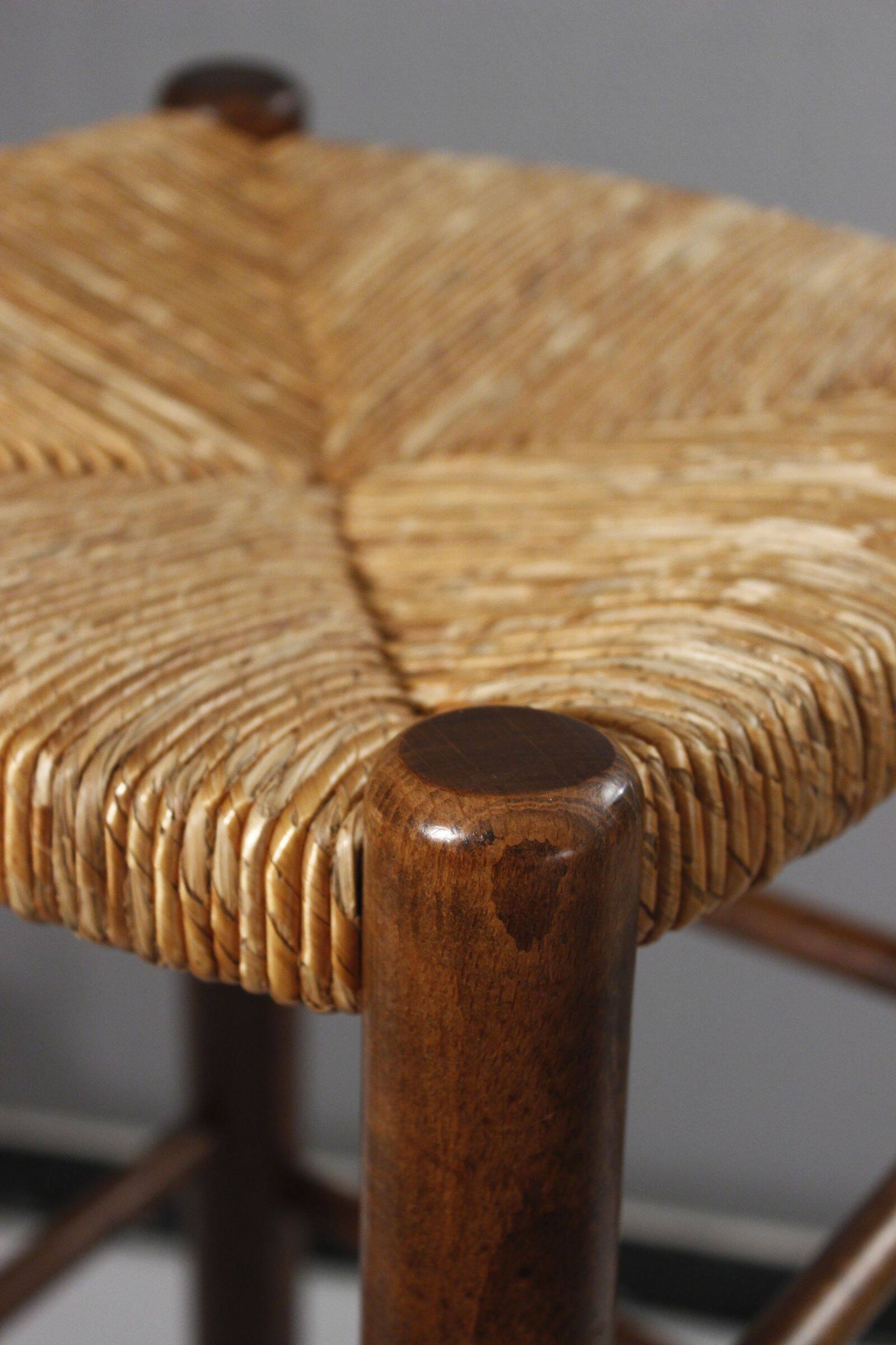 Vintage straw stool in the style of Charlotte Perriand, 1970s.