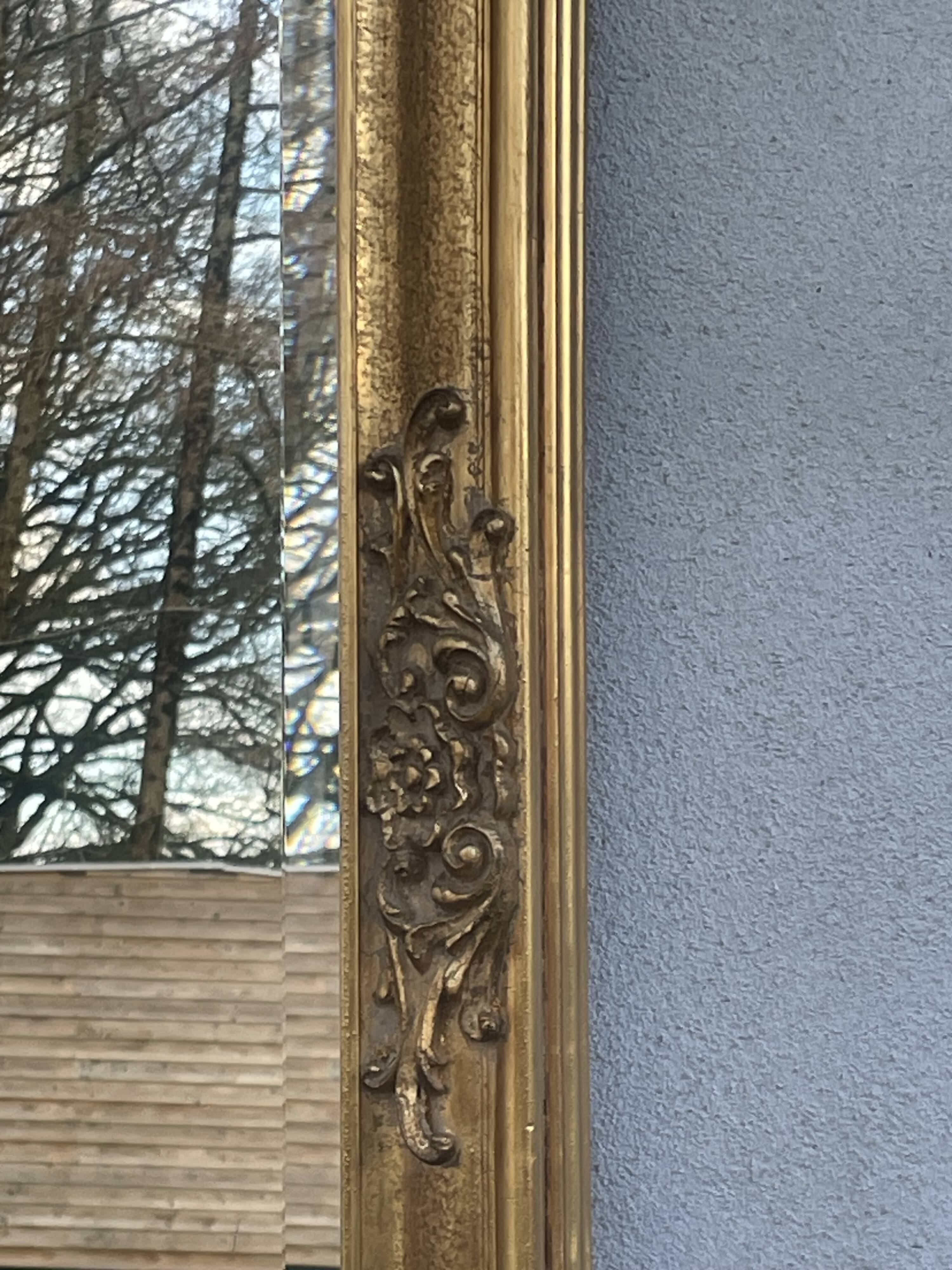 vintage bevelled mirror in rectangular shape, stucco and gilded wood in Louis XV baroque style