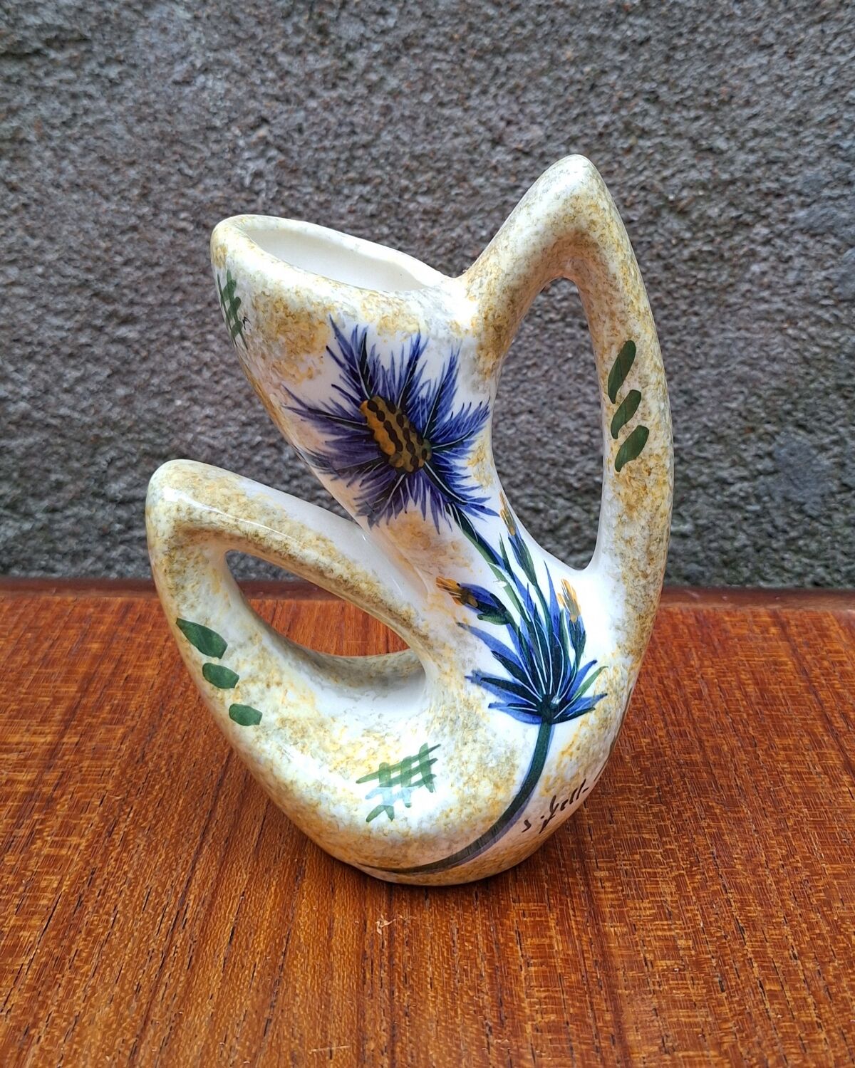 Earthenware vase signed by Jacqueline Gelb with a thistle decoration.