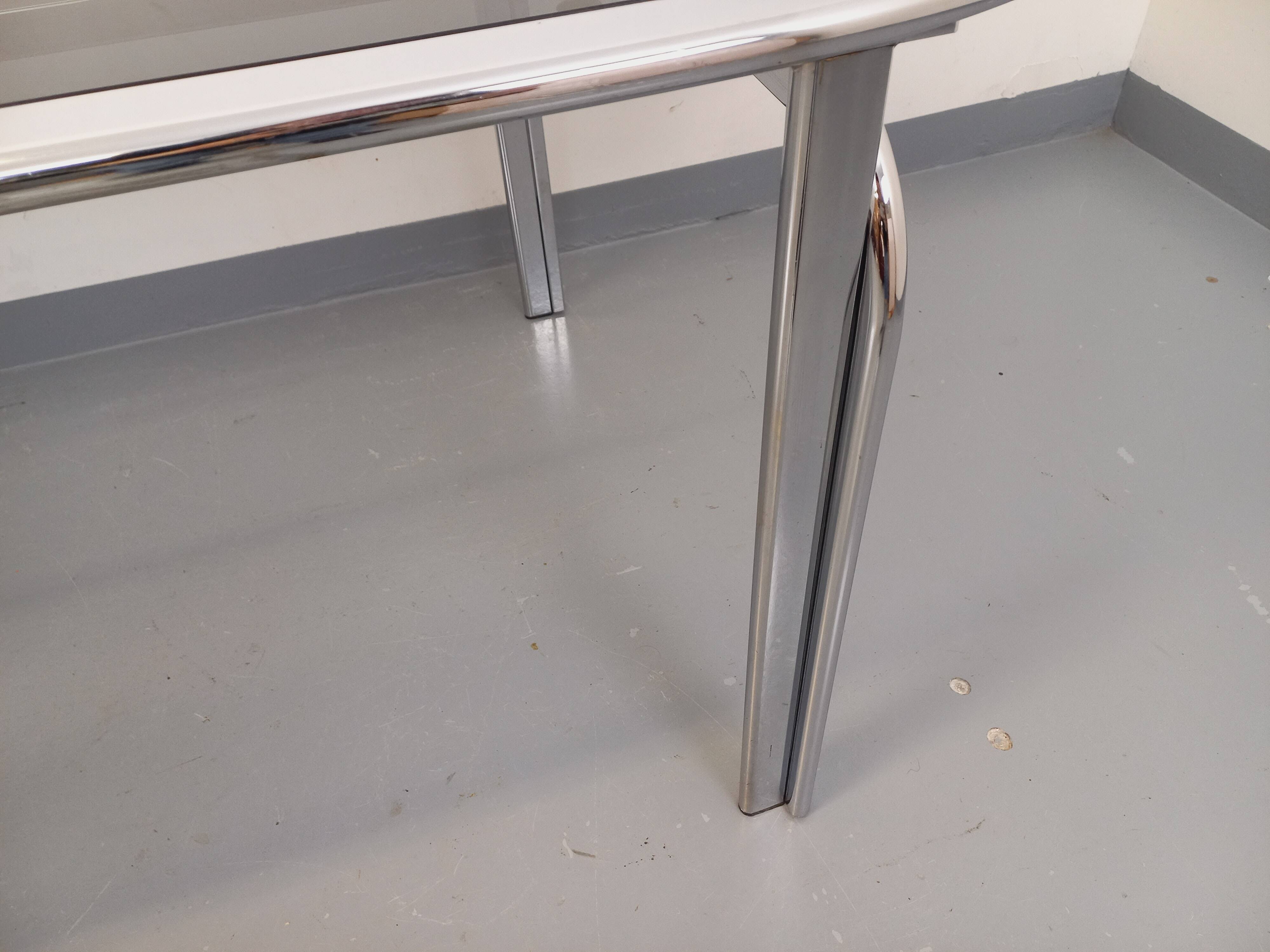 Vintage oval dining table in smoked glass and chrome metal, Space Age style.