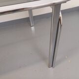 Vintage oval dining table in smoked glass and chrome metal, Space Age style.